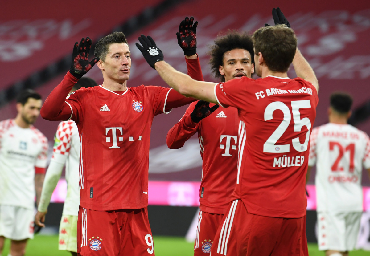 Munich, Germany - January 3, 2021 Bayern Munich's Robert Lewandowski celebrates scoring their fifth goal with Leroy Sane and Thomas Muller Pool via REUTERS/Andreas Gebert DFL regulations prohibit any use of photographs as image sequences and/or quasi-vide