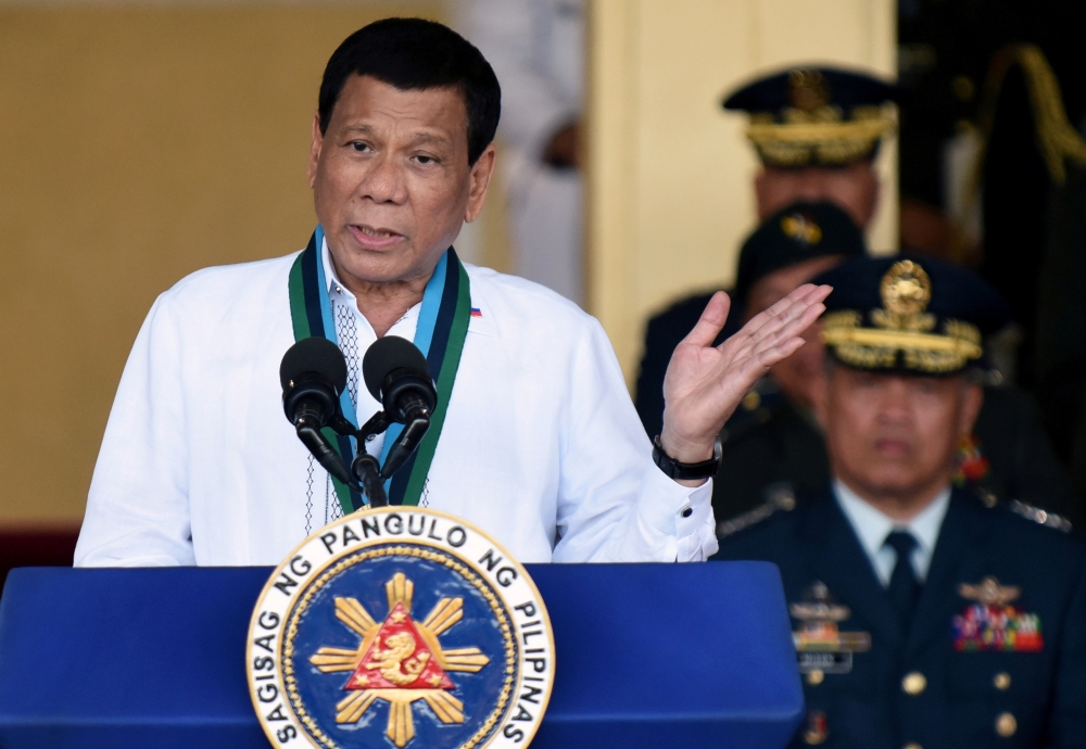 FILE PHOTO: Philippine President Rodrigo Duterte gestures during the change of command ceremony of the Armed Forces of the Philippines (AFP) at Camp Aguinaldo in Quezon City, Metro Manila, Philippines April 18, 2018. REUTERS/Dondi Tawatao/File Photo
