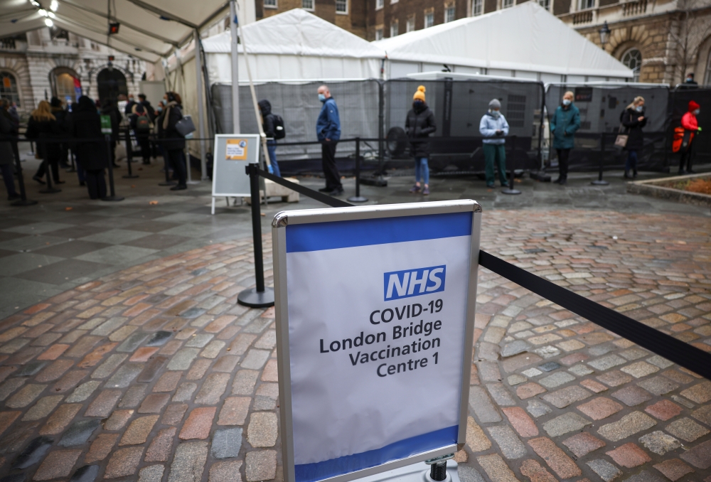People queue at London Bridge Vaccination Centre, amid the coronavirus disease (COVID-19) outbreak, in London, Britain, January 5, 2021. REUTERS/Henry Nicholls