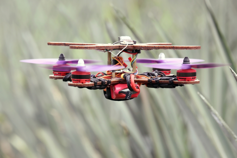 A drone, partially made with pineapple stems, flies at a pineapple plantation in Jenjarom, Malaysia December 12, 2020. Picture taken December 12, 2020. REUTERS/Lim Huey Teng