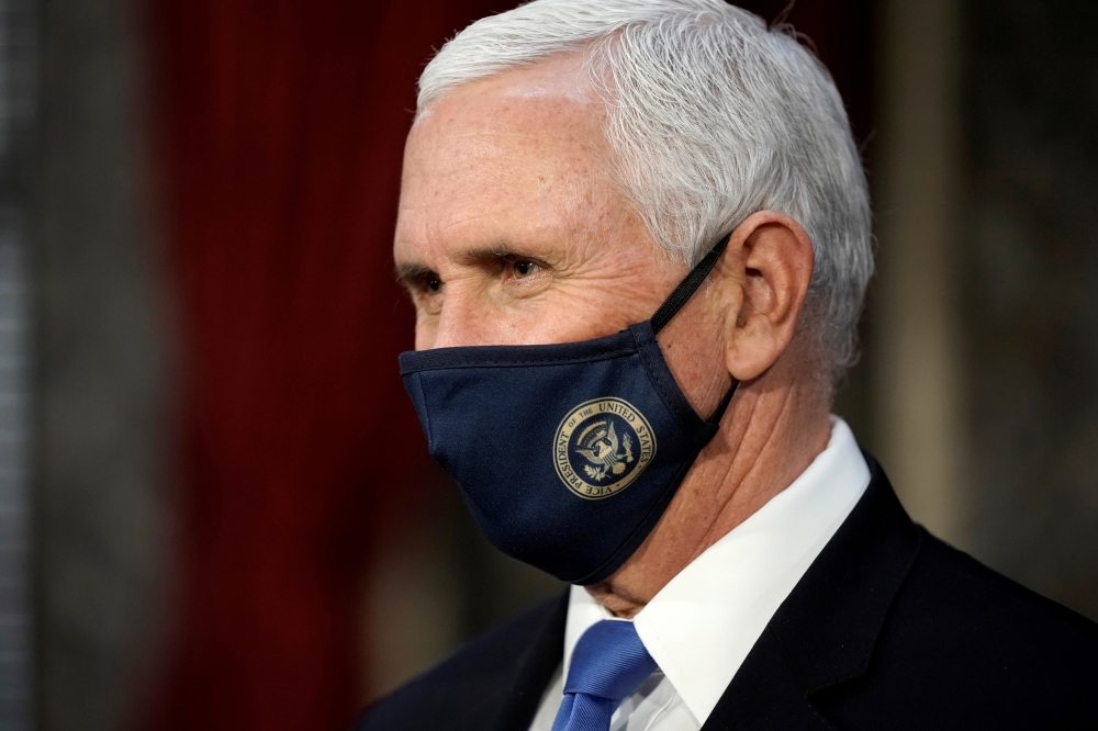 Vice President Mike Pence finishes a swearing-in ceremony for senators in the Old Senate Chamber at the Capitol in Washington, DC, US January 3, 2021. J Scott Applewhite/Pool via REUTERS/File Photo