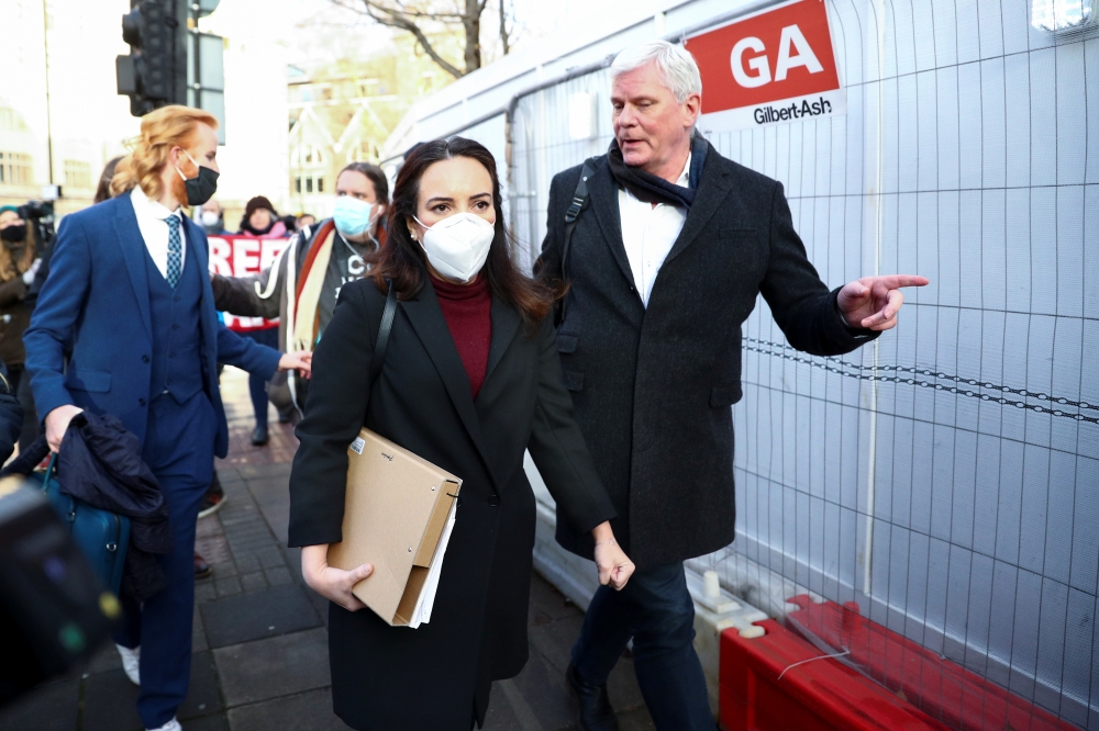 Stella Morris, partner of WikiLeaks founder Julian Assange, Editor in Chief of WikiLeaks Kristinn Hrafnsson and WikiLeaks Ambassador Joseph Farrell leave after a court denied bail to WikiLeaks founder Julian Assange, outside the Westminster Magistrates Co
