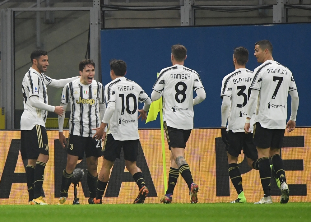 Juventus' Federico Chiesa celebrates scoring their first goal with teammates REUTERS/Alberto Lingria