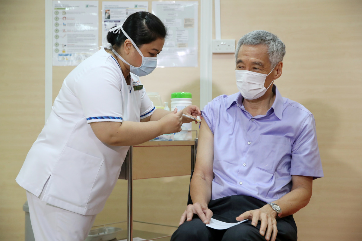 Singapore's Prime Minister Lee Hsien Loong receives his coronavirus disease (COVID-19) vaccination jab at Singapore General Hospital January 8, 2021. Mohd Fyrol/Ministry of Communications and Information/Handout via REUTERS.