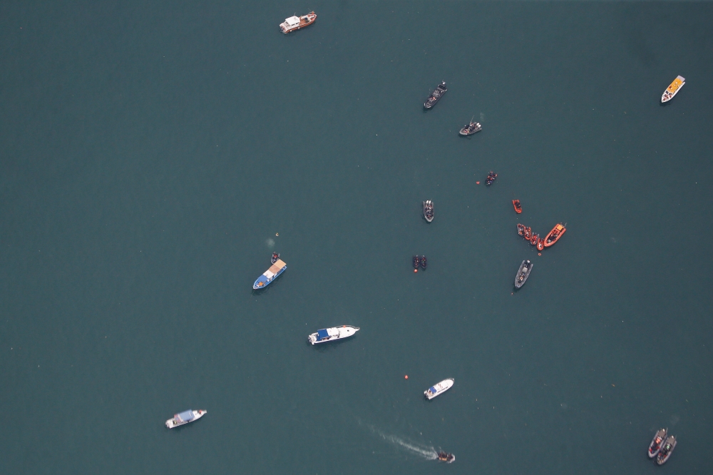 Ships and boats are pictured during a search for the Sriwijaya Air SJ-182, which crashed to the sea, in Jakarta, Indonesia, January 10, 2021. REUTERS/Willy Kurniawa