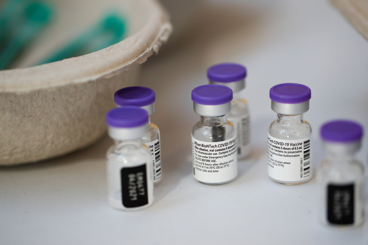 Vials of the Pfizer-BioNTech COVID-19 vaccine are seen at a coronavirus disease vaccination center inside a gymnasium in Taverny near Paris, France, January 9, 2021. REUTERS/Benoit Tessier
