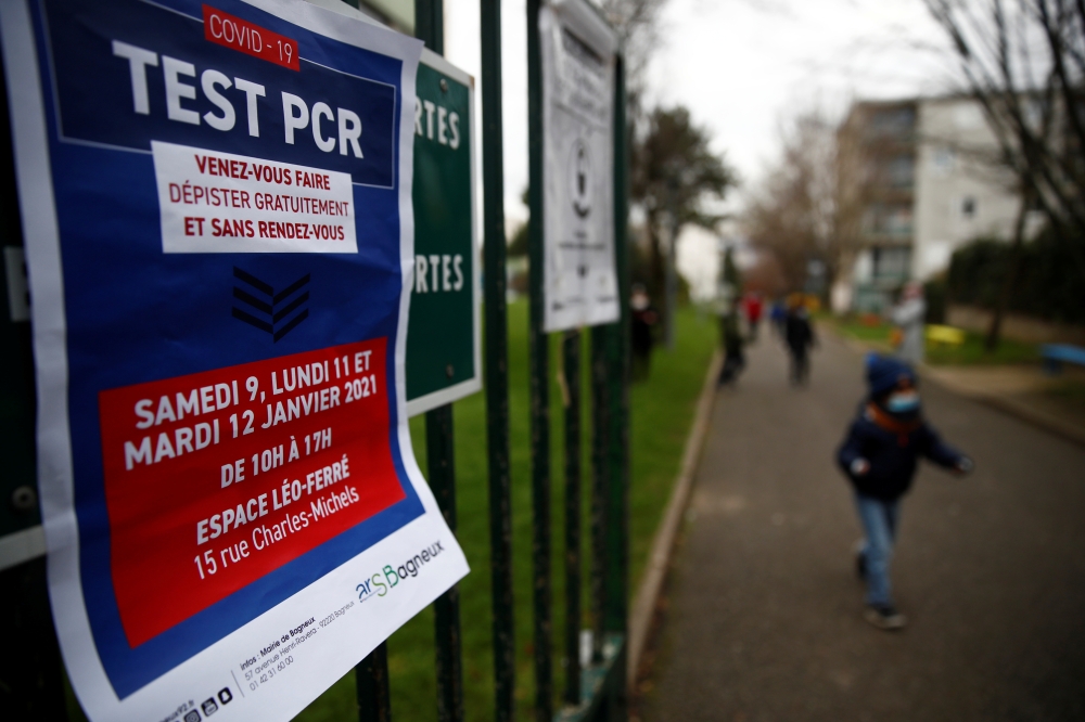 A placard which reads 