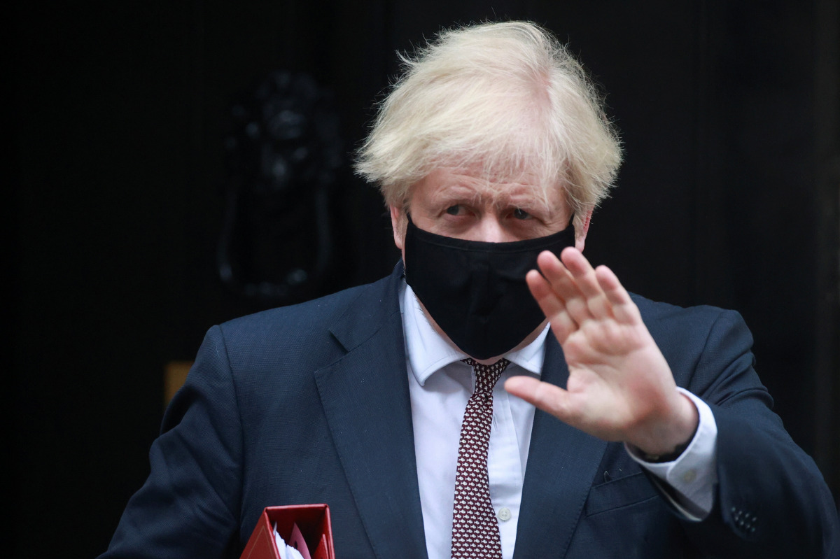 Britain's Prime Minister Boris Johnson leaves Downing Street in London, Britain January 13, 2021. REUTERS/Hannah McKay
