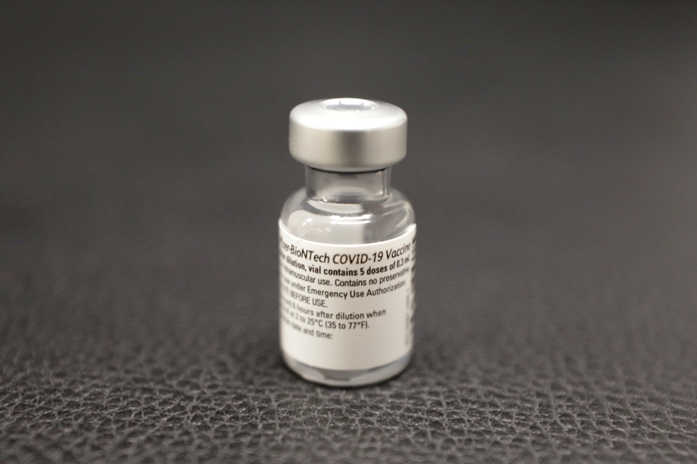 A vial of the Pfizer-BioNTech Covid-19 vaccine is seen at a coronavirus disease vaccination center. Reuters/Eric Gaillard/File Photo