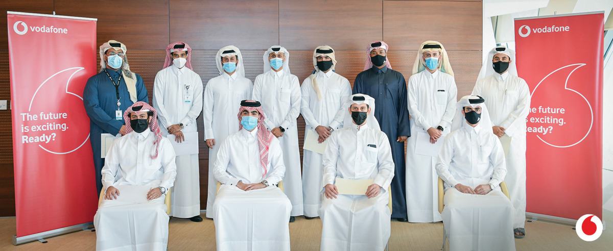 Khames Mohammed Al Naimi, Chief Human Resources Officer at Vodafone Qatar, with the Qatari employees who undertook the Telecoms MBA. 