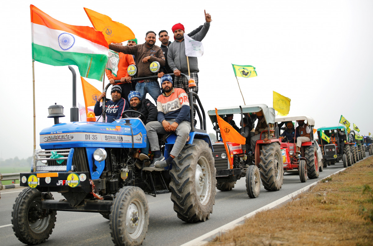 FILE PHOTO: Farmers participate in a tractor rally to protest against the newly passed farm bills, on a highway on the outskirts of New Delhi, India, January 7, 2021. REUTERS/Adnan Abidi/File Photo
