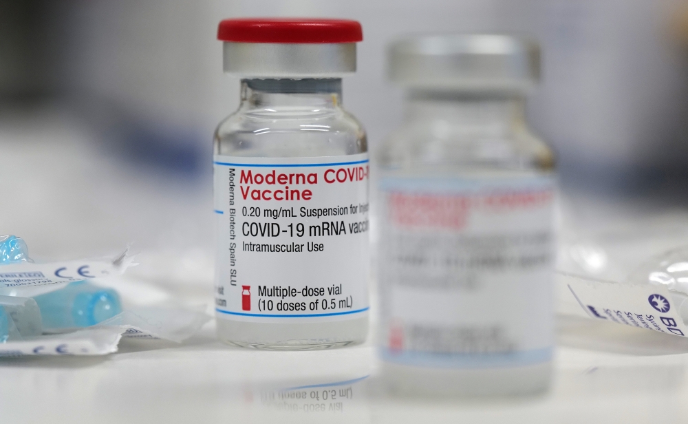 A vial of the Moderna COVID-19 vaccine is seen at a local clinic as the spread of the coronavirus disease continues in Aschaffenburg, Germany, January 15, 2021. Reuters/Kai Pfaffenbach/File Photo
