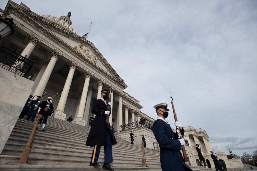 The Honour Guard arrives at the East Front of the U.S. Capitol during the dress rehearsal ahead of U.S. President-elect Joe Biden's inauguration in Washington, U.S., January 18, 2021. Rod Lamkey/Pool via REUTERS