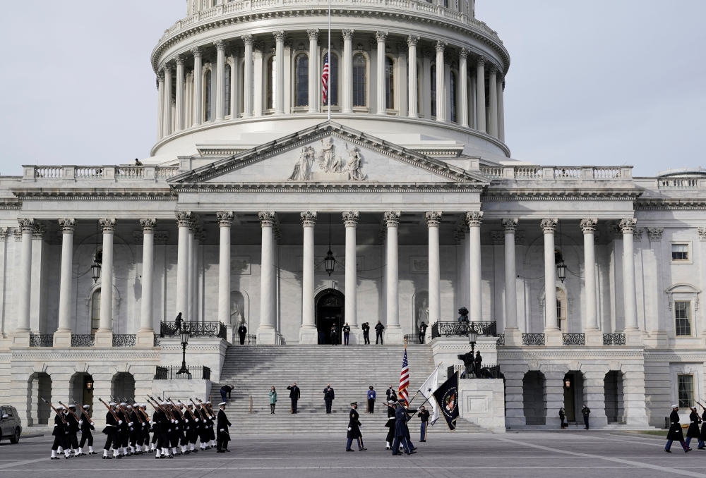 U.S. military units march in front of the U.S. Capitol as they rehearse for U.S. President-elect Joe Biden's inauguration ceremony, in Washington, U.S., January 18, 2021. J. Scott Applewhite/Pool via REUTERS
