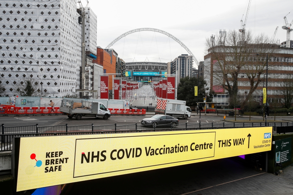 A sign of a NHS vaccination centre is seen, amid the spread of the coronavirus disease (COVID-19), in Wembley, London, Britain, January 18, 2021. REUTERS/Matthew Childs