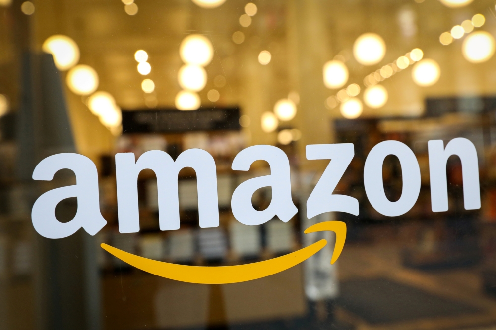 File photo: Logo of Amazon is seen on the door of an Amazon Books retail store. REUTERS/Brendan McDermid/File Photo