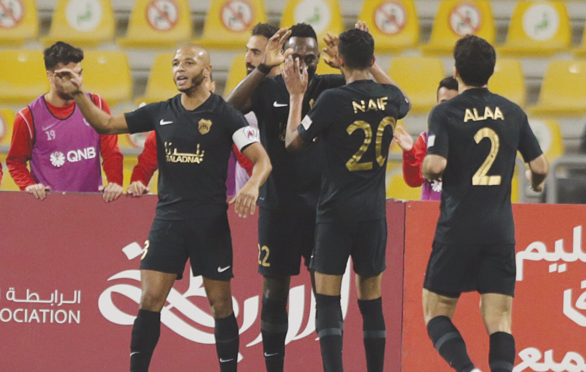 Al Rayyan's Yohan Boli (second left) celebrates with team-mates after scoring their second goal against Al Wakrah yesterday.