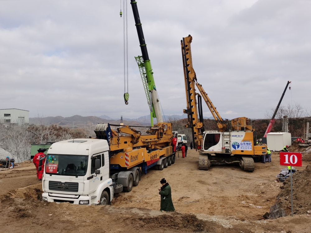 Rescuers are seen at the site where workers were trapped underground after an explosion at the gold mine under construction, in Qixia, Shandong province, China January 20, 2021. China Daily via REUTERS