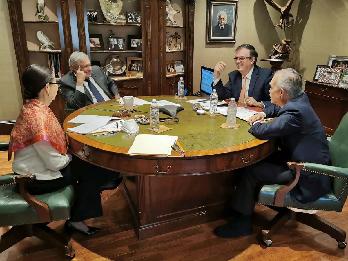 Mexican President Andres Manuel Lopez Obrador (2nd L) holds a call with U.S. President Joe Biden, accompanied by Mexico's Foreign Minister Marcelo Ebrard, businessman Alfonso Romo and Mexico's Security Minister Rosa Icela Rodriguez, in San Pedro Garza, in