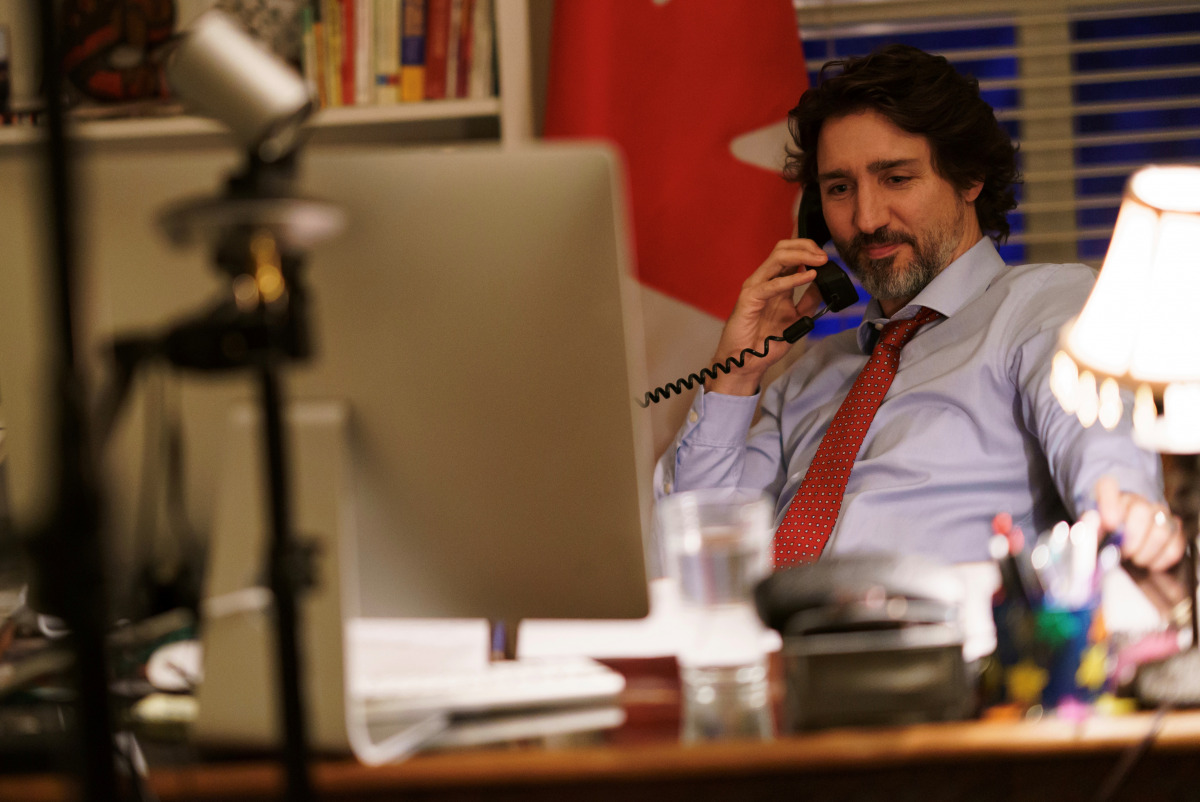 Canada's Prime Minister Justin Trudeau speaks on the phone with U.S. President Joe Biden, who made the first call to a foreign leader following his inauguration, in Ottawa, Ontario, Canada January 22, 2021. Picture taken January 22, 2021. Adam Scotti/Prim
