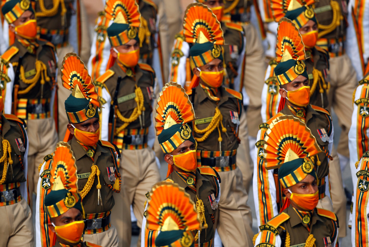 Indian soldiers wearing protective face masks march during the full dress rehearsal for the Republic Day parade in New Delhi, India, January 23, 2021. REUTERS/Adnan Abidi
