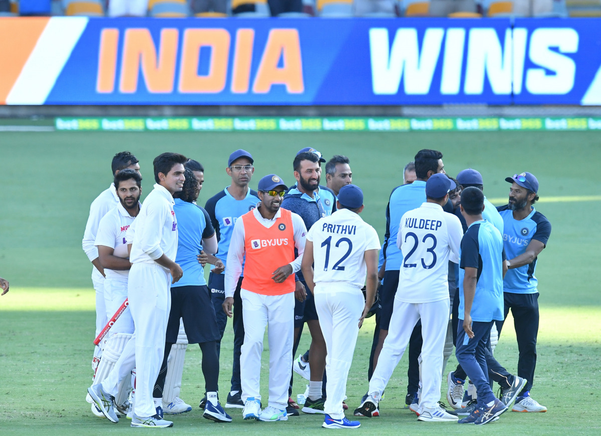 India celebrates winning on day five of the fourth test match between Australia and India at the Gabba in Brisbane, Australia, January 19, 2021. AAP Image/Darren England via REUTERS ATTENTION EDITORS - THIS IMAGE WAS PROVIDED BY A THIRD PARTY. NO RESALES.