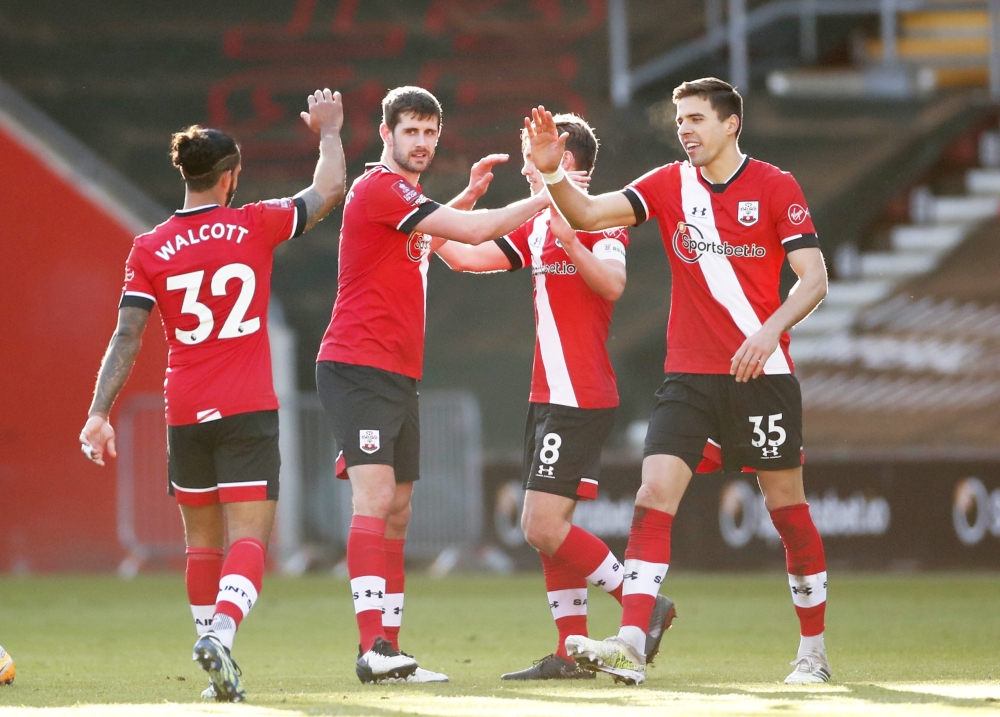 Southampton's Jan Bednarek, Jack Stephens and Theo Walcott celebrate after the match Action Images via Reuters/Andrew Boyers