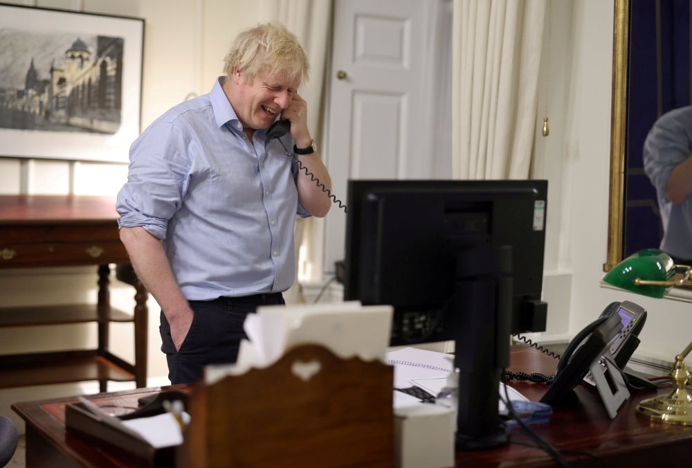 British Prime Minister Boris Johnson speaks to U.S. President Joe Biden from London, Britain, in this social media image obtained on January 23, 2021. Downing Street Handout /Crown copyright 2021/via Reuters 
