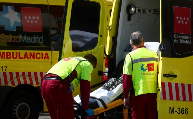 FILE PHOTO: Health workers unload a stretcher with a patient from an ambulance in the emergency unit at 12 de Octubre hospital amid the coronavirus disease (COVID-19) pandemic, in Madrid, Spain, September 4, 2020. REUTERS/Sergio Perez
