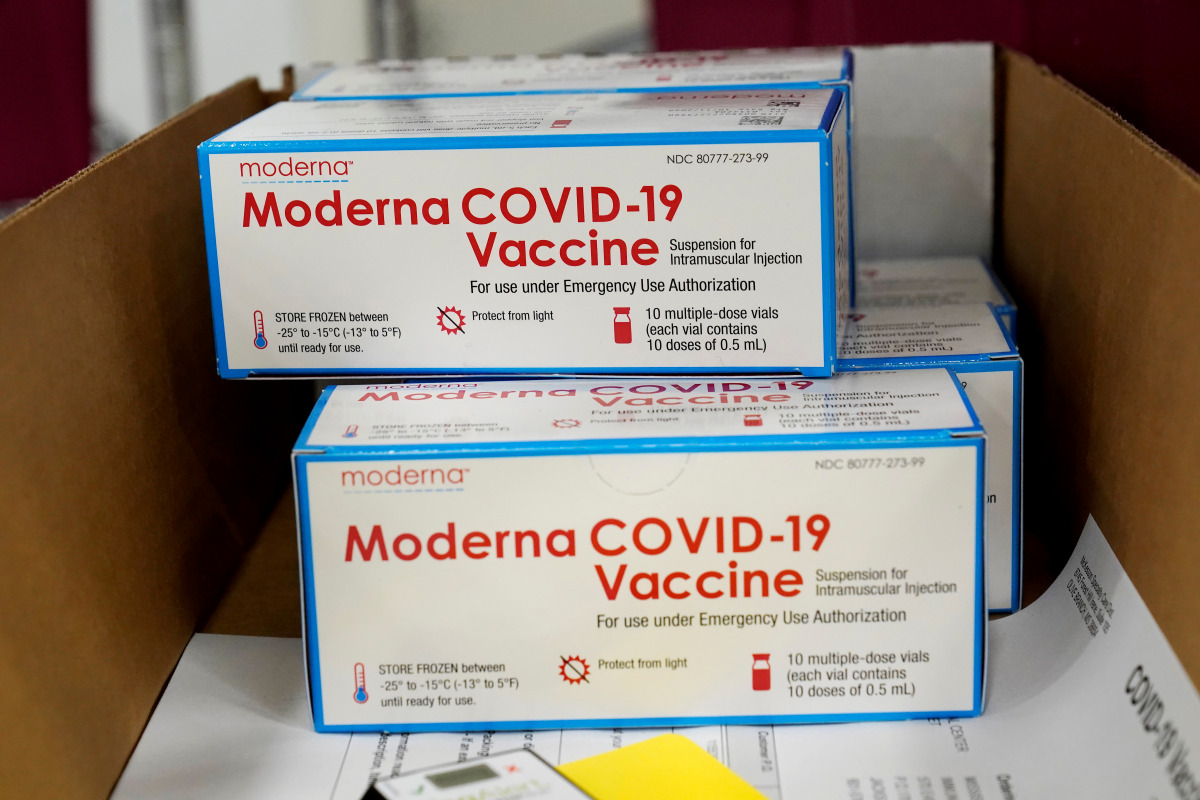 FILE PHOTO: Boxes containing the Moderna COVID-19 vaccine are prepared to be shipped at the McKesson distribution center in Olive Branch, Mississippi, U.S. December 20, 2020. Paul Sancya/Pool via REUTERS/File Photo
