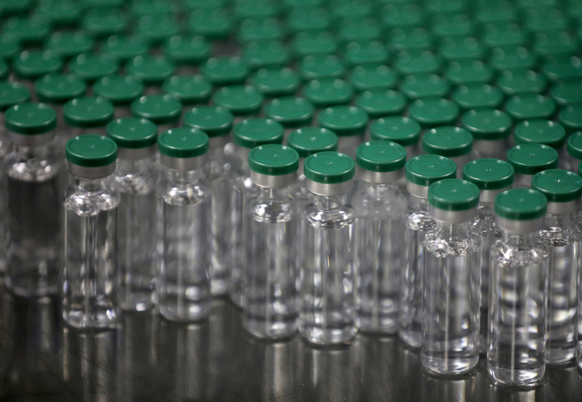 FILE PHOTO: Vials of AstraZeneca's Covishield coronavirus (COVID-19) vaccine, are seen before they are packaged inside a lab at Serum Institute of India, Pune, India, November 30, 2020. REUTERS/Francis Mascarenhas/File Photo
