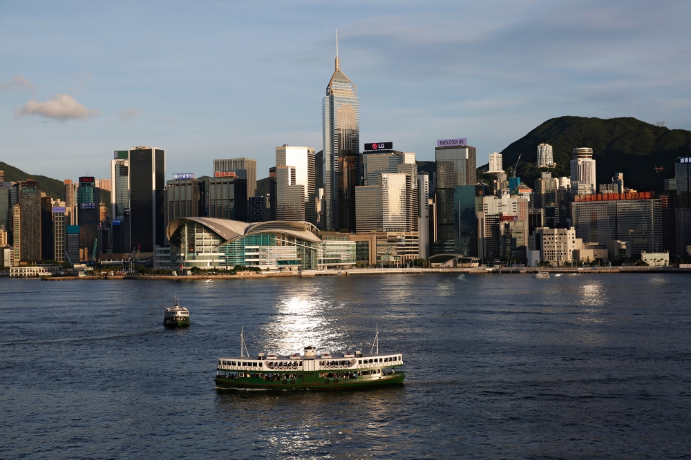 A Star Ferry boat crosses Victoria Harbour in front of a skyline of buildings in Hong Kong, China June 29, 2020. Reuters/Tyrone Siu/File Photo