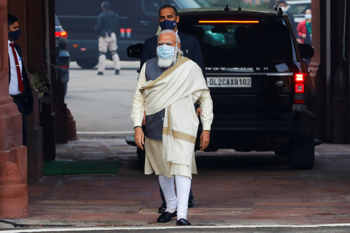 India's Prime Minister Narendra Modi walks to speak with the media as he arrives at the parliament house to attend the first day of the budget session, in New Delhi, India, January 29, 2021. REUTERS/Adnan Abidi
