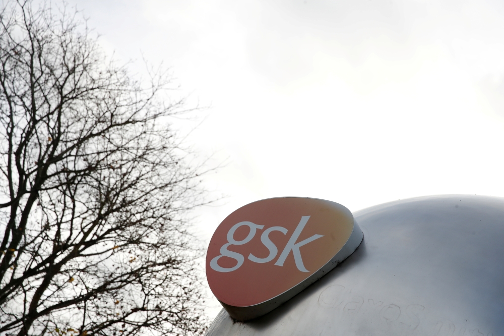 File photo: Company logo of the pharmaceutical company GlaxoSmithKline is seen at their Stevenage facility, Britain October 26, 2020. Reuters/Matthew Childs/File Photo 