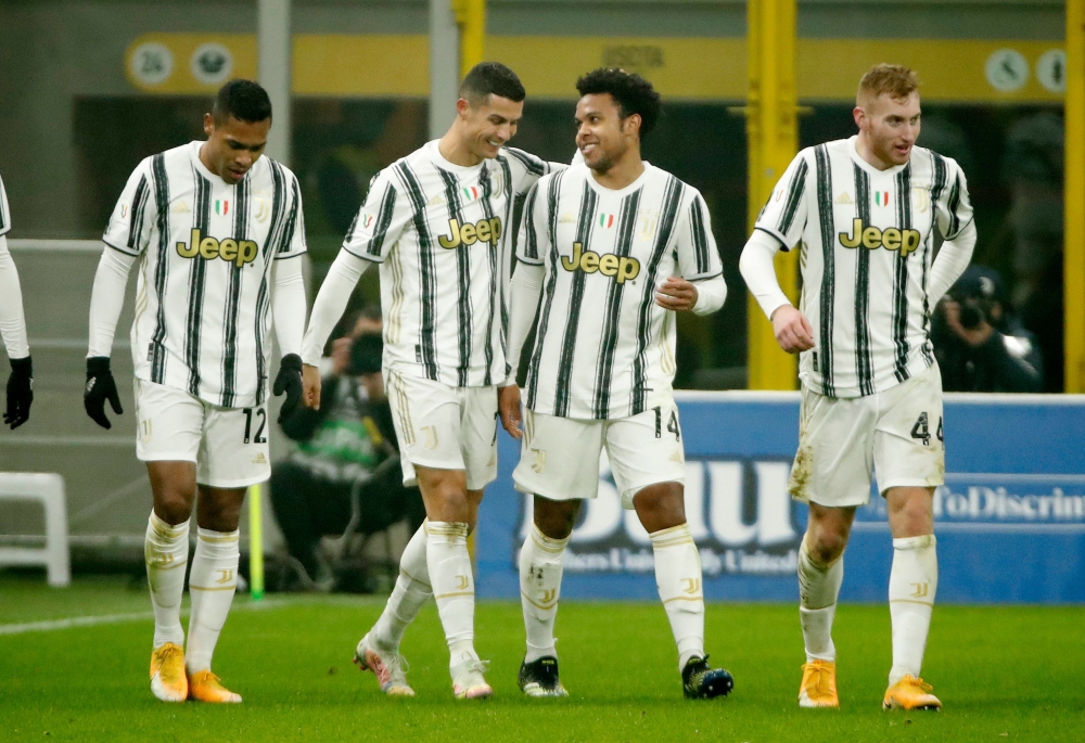 Juventus' Cristiano Ronaldo celebrates scoring their second goal with teammates REUTERS/Alessandro Garofalo