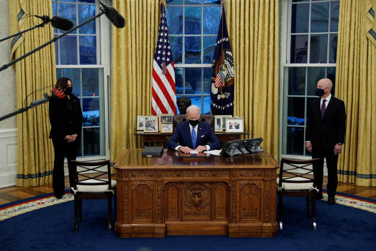 U.S. President Joe Biden prepares to sign executive orders on immigration at the White House in Washington, U.S., February 2, 2021. REUTERS/Tom Brenner
