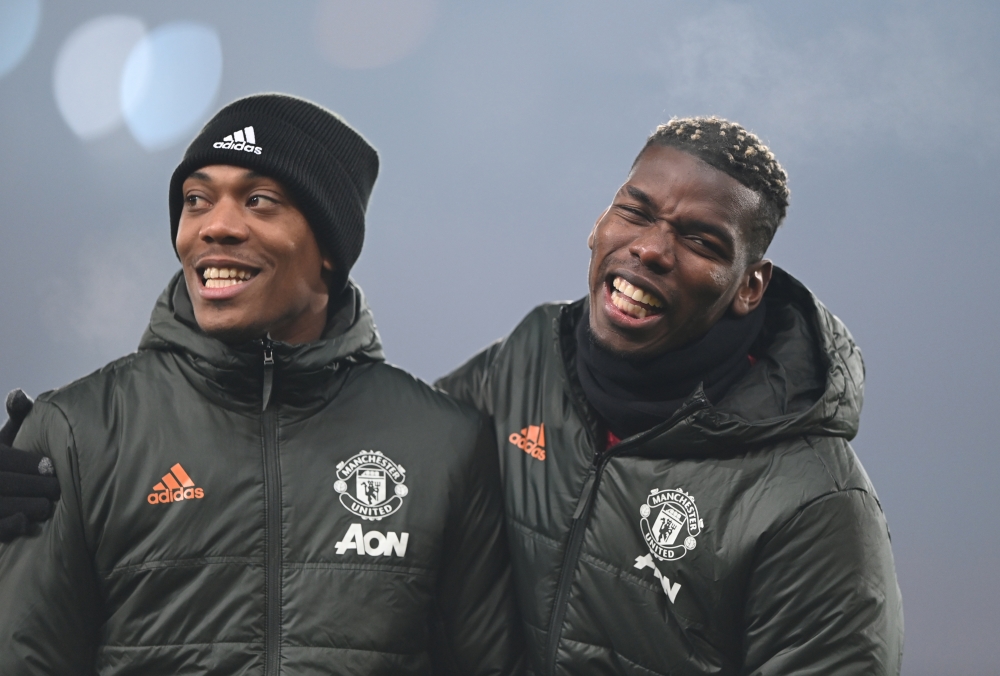 Manchester United's Paul Pogba and Anthony Martial during the warm up before the match Pool via REUTERS/Laurence Griffiths 