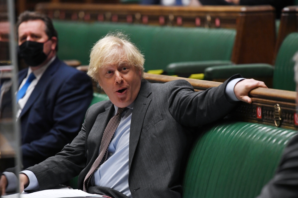Britain's Prime Minister Boris Johnson speaks during a question period at the House of Commons in London, Britain February 3, 2021. UK Parliament/Jessica Taylor/Handout via REUTERS 