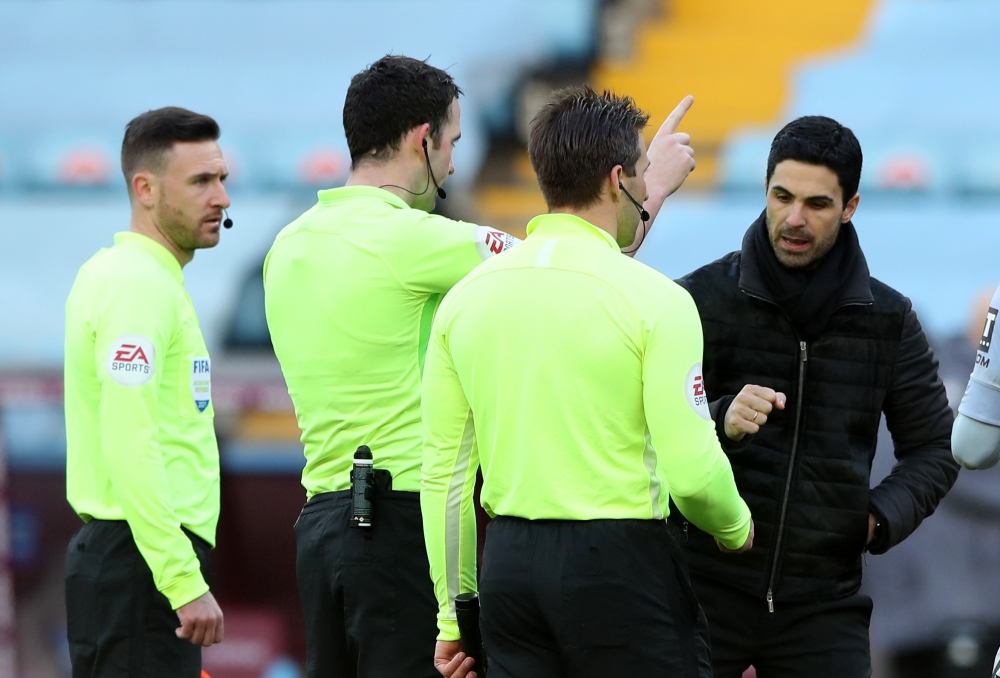 Arsenal manager Mikel Arteta with referee Chris Kavanagh and the assistant referees after the match Pool via REUTERS/Nick Potts