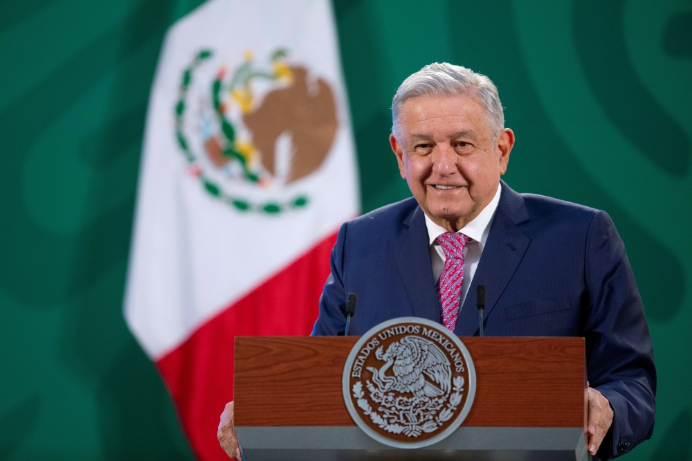Mexican President Andres Manuel Lopez Obrador holds his first news conference following a coronavirus disease (COVID-19) infection, at the National Palace in Mexico City, Mexico February 8, 2021. Mexico's Presidency/Handout via REUTERS