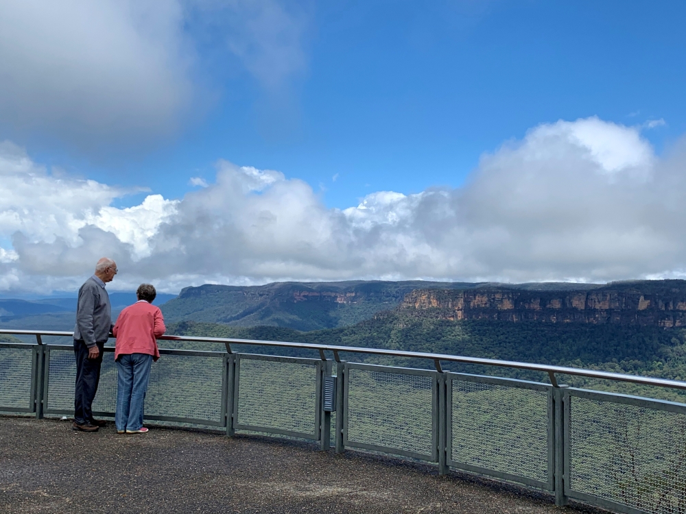 People look at the Blue Mountains from the Echo Point lookout in the Blue Mountains, New South Wales, Australia, February 2, 2021. REUTERS/Stefica Nicole Bikes