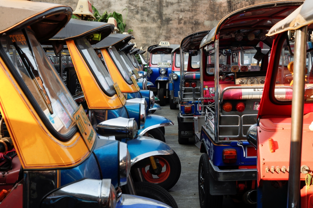 Tuk-tuks that are used to transport tourists around the city are seen idle due to travel bans and border closures from the global coronavirus disease (COVID-19) outbreak in a parking lot in downtown Bangkok, Thailand February 3, 2021. Picture taken Februa