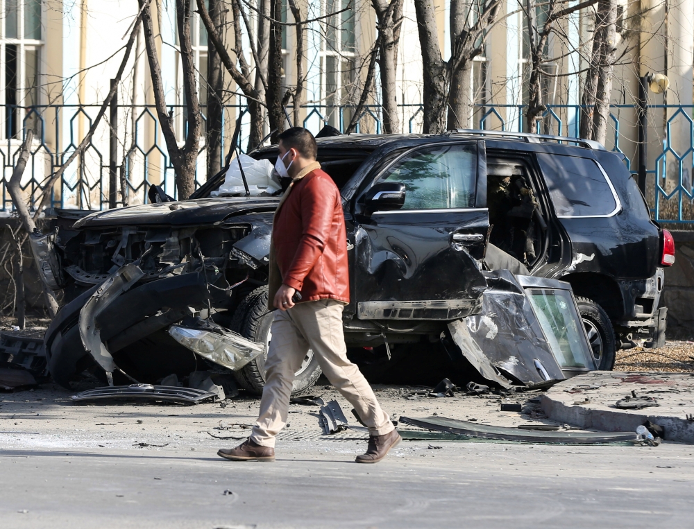 An Afghan security official inspects the site of a bomb blast in Kabul, Afghanistan February 9, 2021. Reuters/Omar Sobhani

