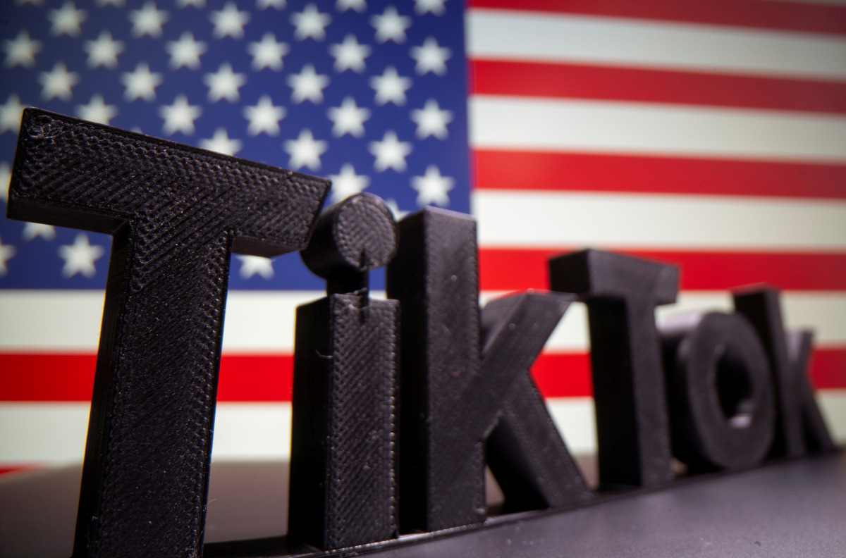 FILE PHOTO: A 3D printed Tik Tok logo is seen in front of U.S. flag in this illustration taken October 6, 2020. Picture taken October 6, 2020. REUTERS/Dado Ruvic/Illustration/File Photo

