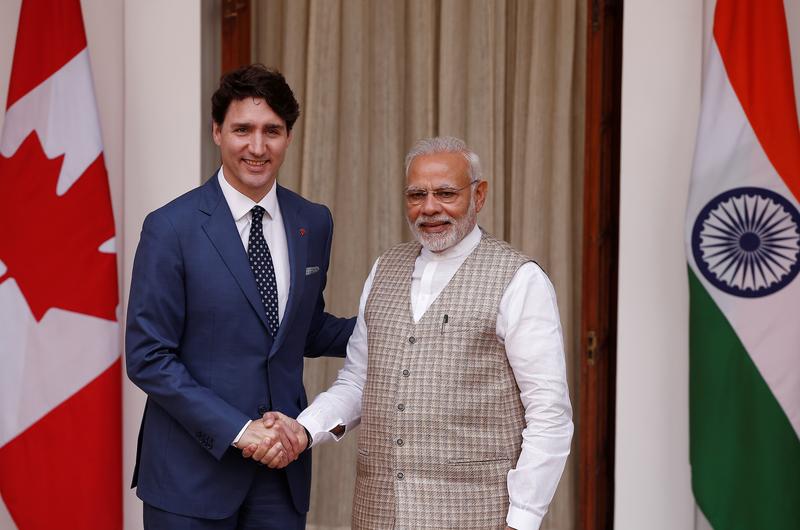FILE PHOTO: Canadian Prime Minister Justin Trudeau (L) shakes hands with his Indian counterpart Narendra Modi during a photo opportunity ahead of their meeting at Hyderabad House in New Delhi, India, February 23, 2018. REUTERS/Adnan Abidi
