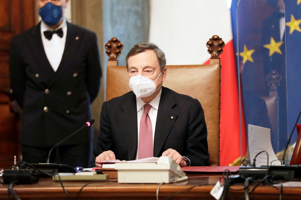 New Italian Premier Mario Draghi presides over his first cabinet of ministers reunion after the swearing-in ceremony, at Chigi Palace Premier's office, in Rome, Italy February 13, 2021. Andrew Medichini/Pool via REUTERS