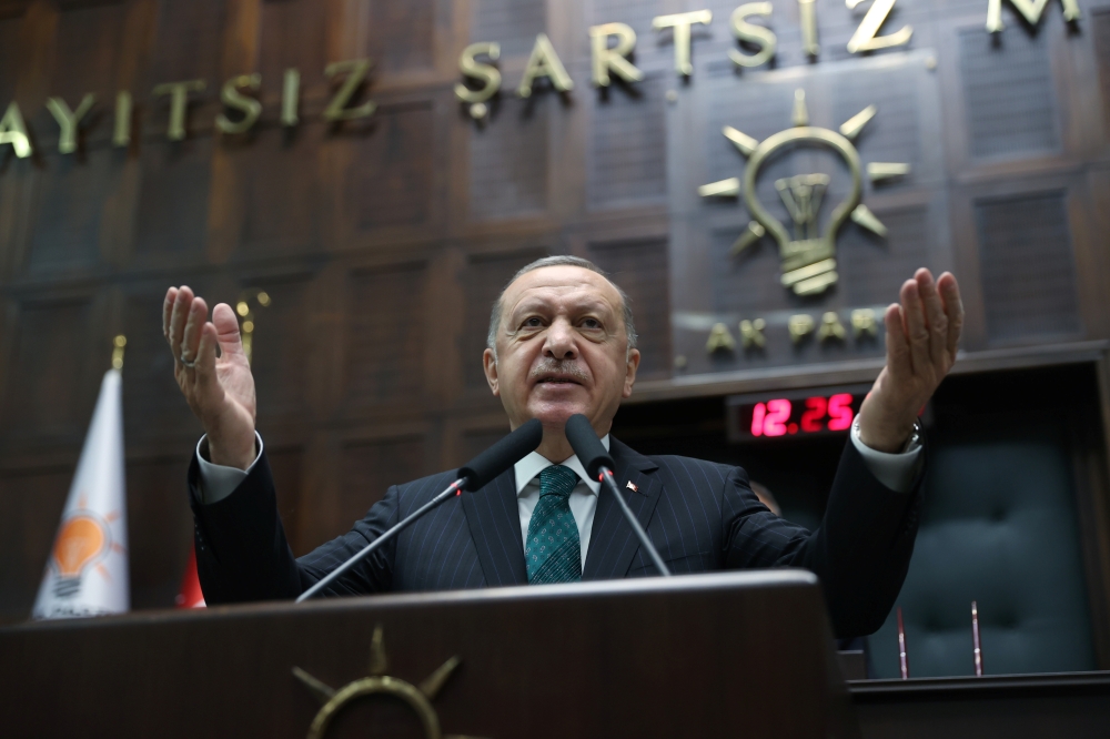 Turkish President Tayyip Erdogan addresses members of parliament from his ruling AK Party (AKP) during a meeting at the Turkish parliament in Ankara, Turkey, February 10, 2021. Murat Cetinmuhurdar 