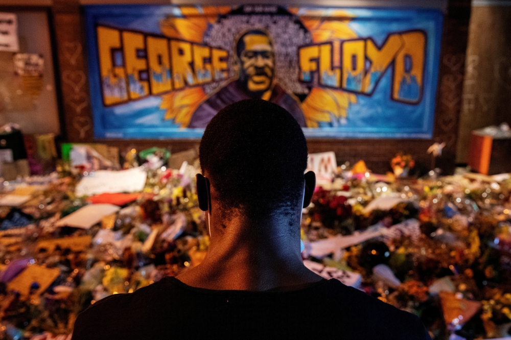FILE PHOTO: A man recites spoken word poetry at a makeshift memorial honoring George Floyd, at the spot where he was taken into custody, in Minneapolis, Minnesota, U.S., June 1, 2020. REUTERS/Lucas Jackson/File Photo/File Photo
