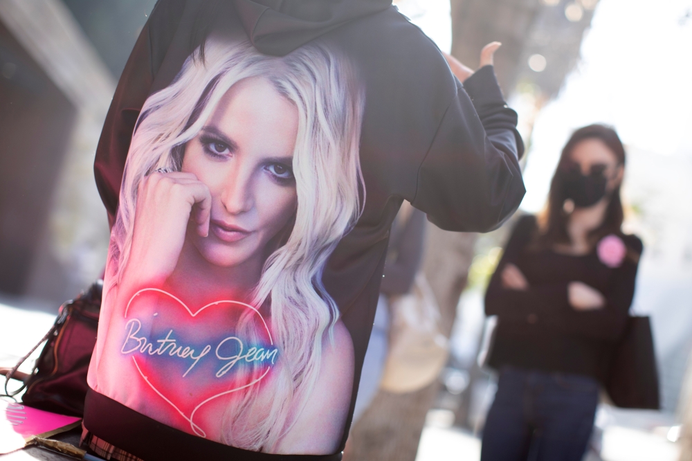 Supporters of singer Britney Spears gather outside a courthouse as a judge hears the singer's temporary conservatorship case during the outbreak of the coronavirus disease (COVID-19) in Los Angeles, California, U.S., February 11, 2021. REUTERS/Mike Blake