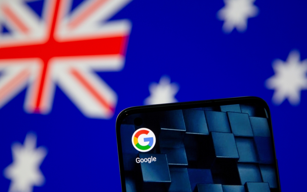 FILE PHOTO: Smartphone with Google app icon is seen in front of the Australian flag in this illustration taken January 22, 2021. REUTERS/Dado Ruvic/Illustration/File Photo